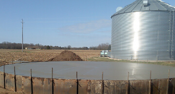 Wet poured concrete in a round grain bin form | Agricultural Concrete Services